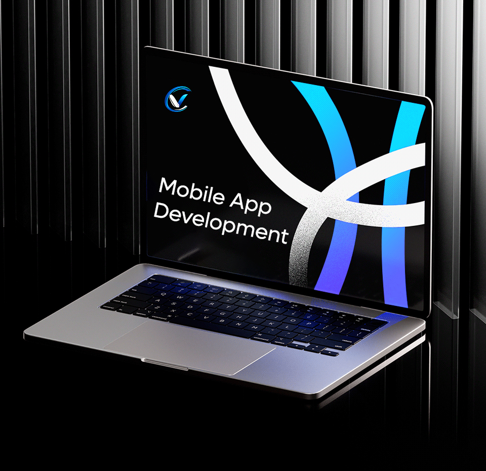 Laptop displaying "Mobile App Development" on screen